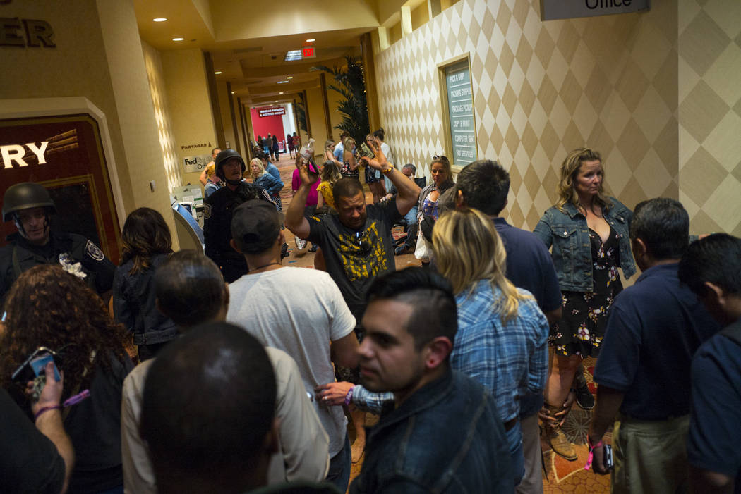 People are searched by Las Vegas police at the Tropicana Las Vegas during an active shooter situation on the Las Vegas Stirp in Las Vegas on Sunday, Oct. 1, 2017. Chase Stevens Las Vegas Review-Jo ...