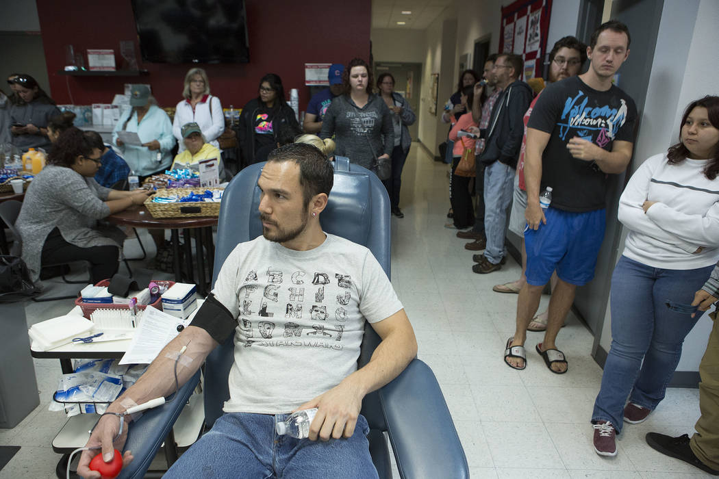 Robin Aiello donates blood at United Blood Services in Las Vegas Monday, Oct. 2, 2017, following a shooting on the Strip that left 59 dead and over 500 injured Sunday night. Bridget Bennett Las Ve ...