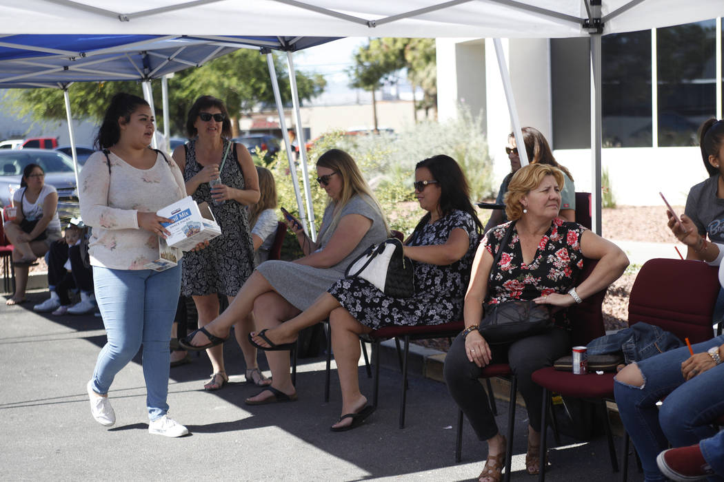 People wait in chairs to donate blood at the University Medical Center parking lot in Las Vegas, Monday, Oct. 2, 2017. UMC set up a blood donation area to assist with victims injured in the shooti ...