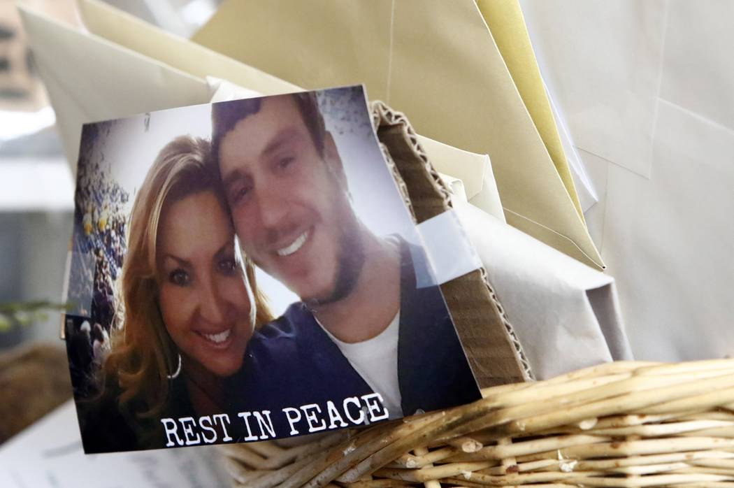 A photo of James "Sonny" Melton and his wife, Heather is seen taped to a basket of cards and letter before the funeral for Sonny Melton on Tuesday, Oct. 10, 2017, in Big Sandy, Tenn. Melton, of Pa ...