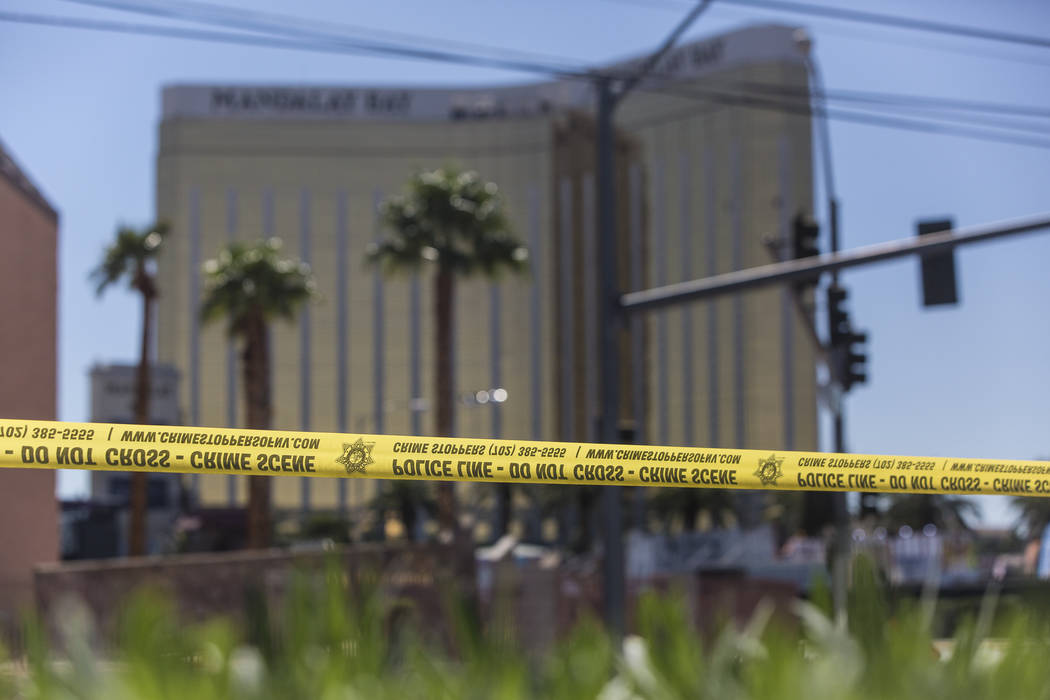 Police tape blocks a section of West Reno Avenue and Las Vegas Boulevard on Monday, October 2, 2017, outside the Mandalay Bay hotel/casino, in Las Vegas. A gunman in a Mandalay Bay hotel room shot ...