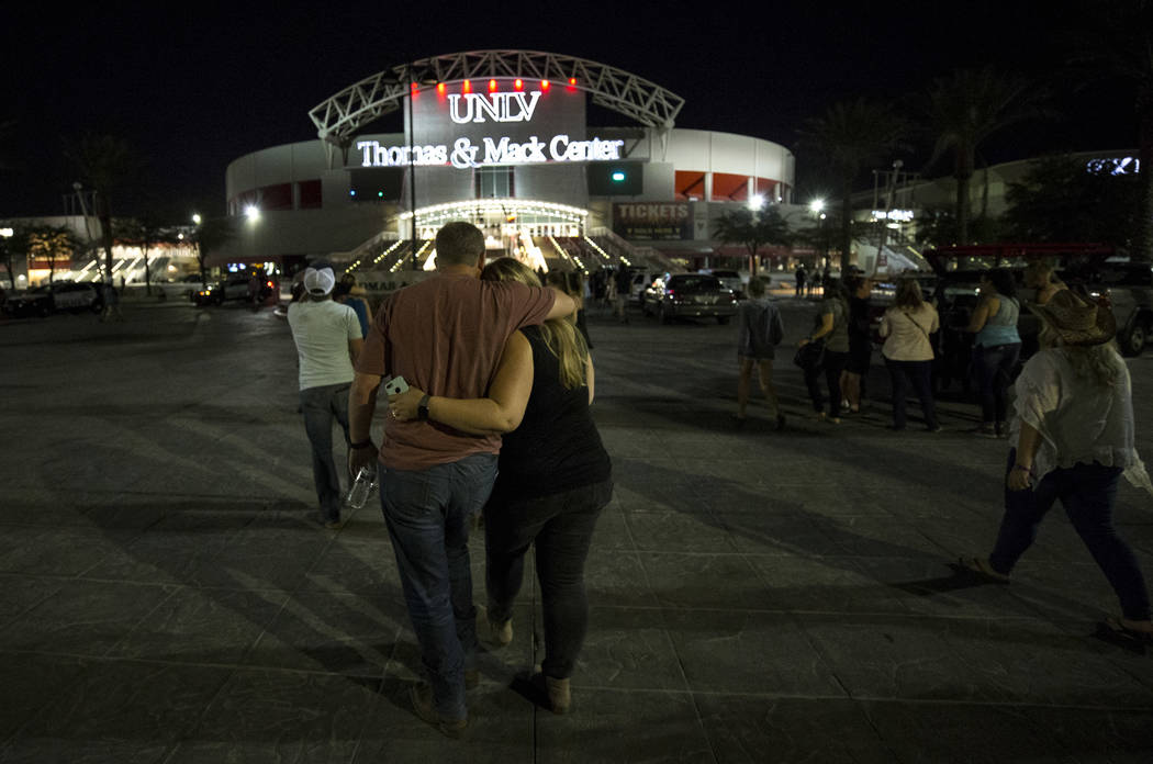 Festival-goers attending the Route 91 Harvest Festival were evacuated by bus to Thomas and Mack Arena early Monday morning, Oct. 2, 2017, following a shooting situation on the Las Vegas Strip. (Ri ...