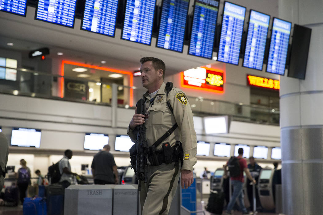 A Las Vegas police officer patrols Terminal 1 at McCarran International Airport in Las Vegas, Monday, Oct. 2, 2017. Erik Verduzco/Las Vegas Review-Journal