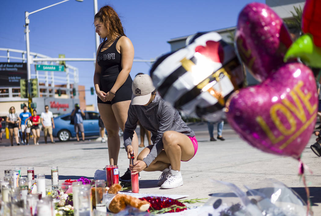 Las Vegas residents Jatziry Yanez, left, and Ana Carbajal at a memorial at Las Vegas Boulevard and Sahara Avenue in Las Vegas during the early hours of Tuesday, Oct. 3, 2017. A gunman opened fire  ...