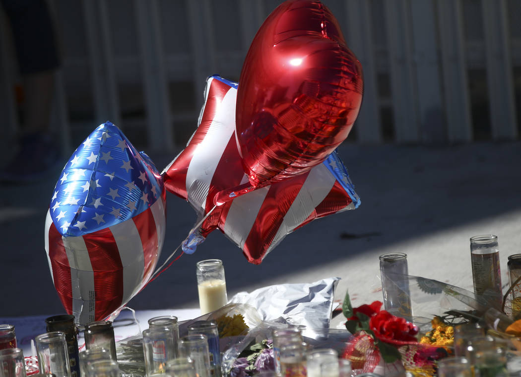 Balloons at a memorial at Las Vegas Boulevard and Sahara Avenue in Las Vegas during the early hours of Tuesday, Oct. 3, 2017. A gunman opened fire on attendees of a music festival Sunday night, re ...