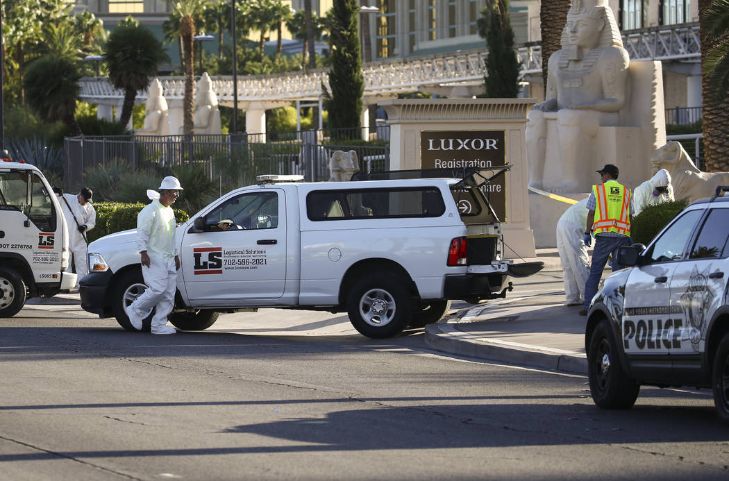 A hazardous materials cleanup crew works near the Route 91 music festival grounds along Las Vegas Boulevard near Reno Avenue in Las Vegas on Tuesday, Oct. 3, 2017. A gunman opened fire on attendee ...