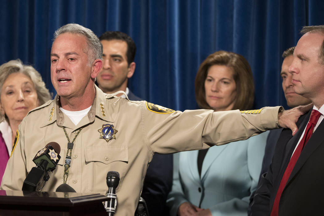 Clark County Sheriff Joe Lombardo, left, recognizes  Aaron C. Rouse, special agent in charge for the FBI in Nevada, during a press conference on the mass shooting at the Las Vegas Metropolitan Pol ...
