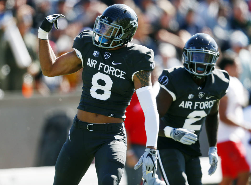 Air Force linebacker Lakota Wills celebrates after intercepting a pass thrown by UNLV quarterback Armani Rogers in the first half of an NCAA college football game Saturday, Oct. 14, 2017, at Air F ...