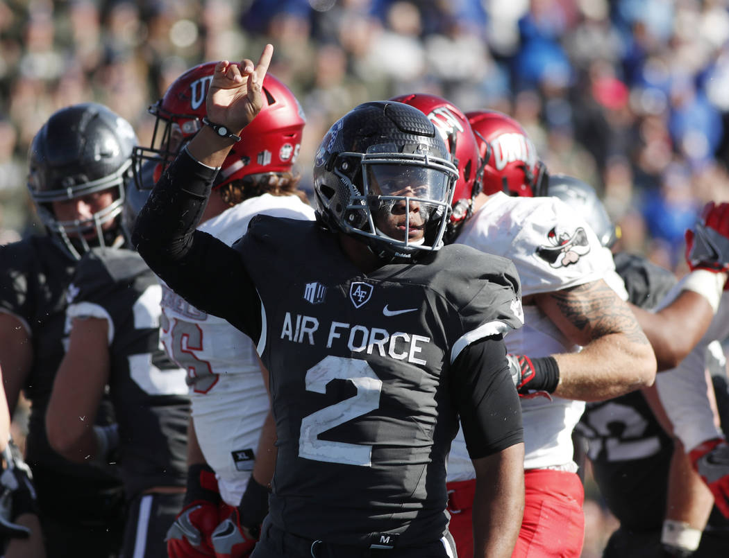 Air Force quarterback Arion Worthman, front, celebrates after rushing for the go-ahead touchdown against UNLV Rebels late in the second half of an NCAA college football game, Saturday, Oct. 14, 20 ...