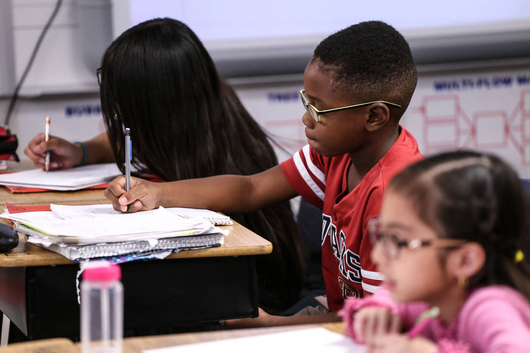 Fifth grader Damian Blake works on an assignment at Sandra Lee Thompson Elementary in Las Vegas, Thursday, Oct. 5, 2017. The elementary school is one of two Clark County School District schools to ...
