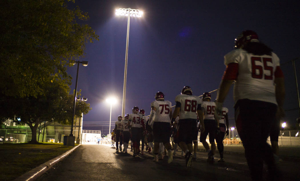 Coronado players head to the field before a football game at Basic High School in Henderson on Friday, Oct. 6, 2017. Hartfield died while off-duty in Sunday's mass shooting. Chase Stevens Las Vega ...