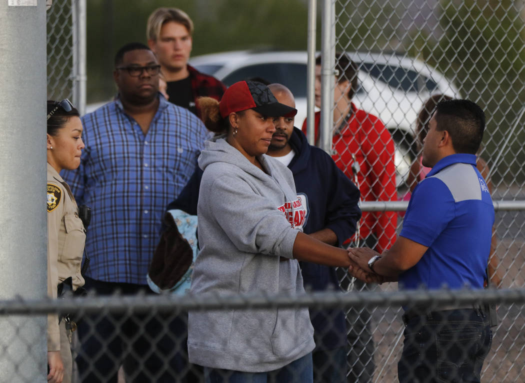 Victoria Hartfield, wife of fallen Las Vegas police officer Charleston Hartfield, arrives with relatives before a football game at Basic High School in Henderson on Friday, Oct. 6, 2017. Hartfield ...