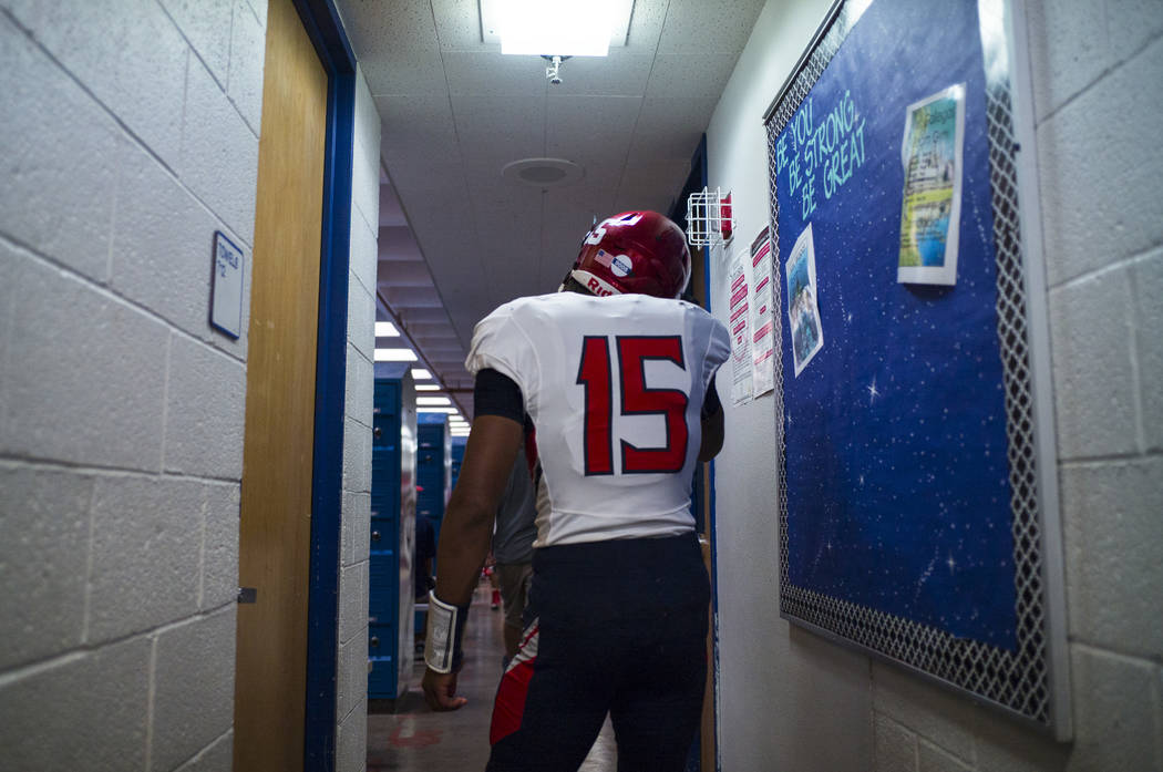 Coronado's Ayzayah Hartfield (15), son of fallen Las Vegas police officer Charleston Hartfield, in the locker room before a football game at Basic High School in Henderson on Friday, Oct. 6, 2017. ...