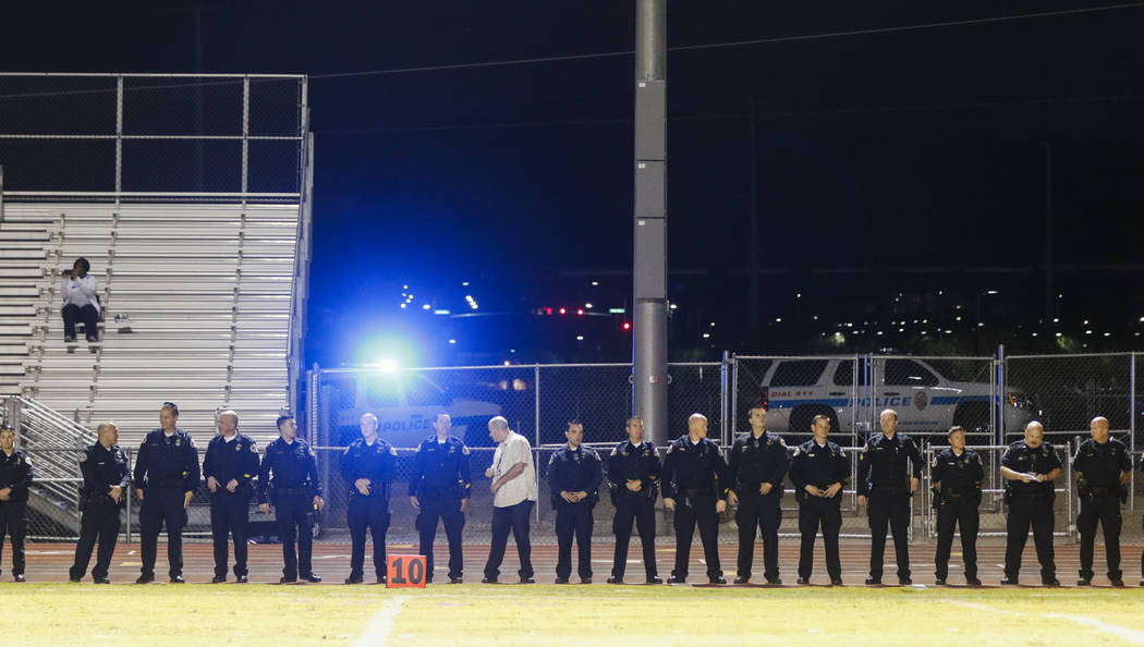 Law enforcement officers gather for fallen Las Vegas police officer Charleston Hartfield before a football game at Basic High School in Henderson on Friday, Oct. 6, 2017. Hartfield died while off- ...