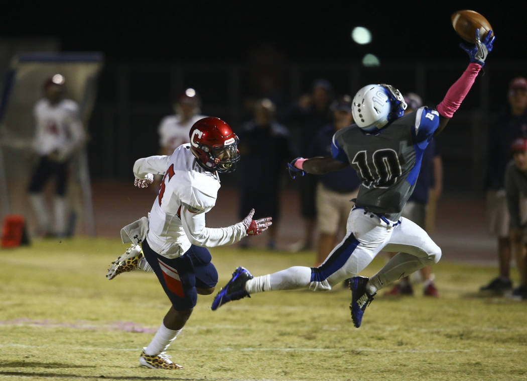 Basic's Franco Mays (10) tries to intercept a pass intended for Coronado's Semaj Bolin (6) during a football game at Basic High School in Henderson on Friday, Oct. 6, 2017. Basic won 45-22. Chase  ...