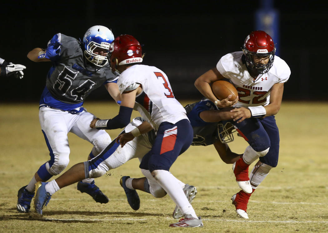 Coronado's Carlos Perez (22) is tackled by a Basic player during a football game at Basic High School in Henderson on Friday, Oct. 6, 2017. Basic won 45-22. Chase Stevens Las Vegas Review-Journal  ...