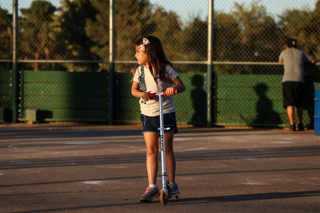 Hailey Dawson, 7, of Henderson rides her scooter at Sunset Park in Las Vegas, Thursday, Oct. 5, 2017. A group of researches at University of Las Vegas created a 3-D prosthetic hand for Dawson, who ...