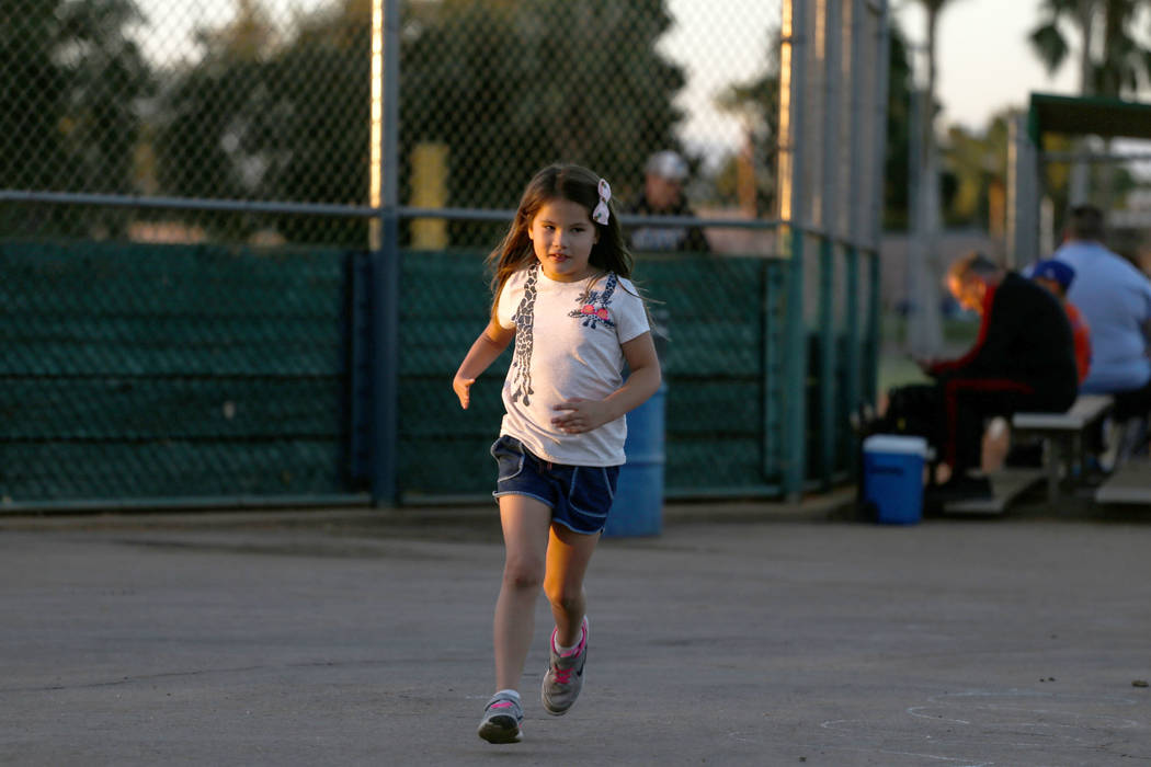 Hailey Dawson, 7, of Henderson runs at Sunset Park in Las Vegas, Thursday, Oct. 5, 2017. A group of researches at University of Las Vegas created a 3-D prosthetic hand for Dawson, who was born wit ...