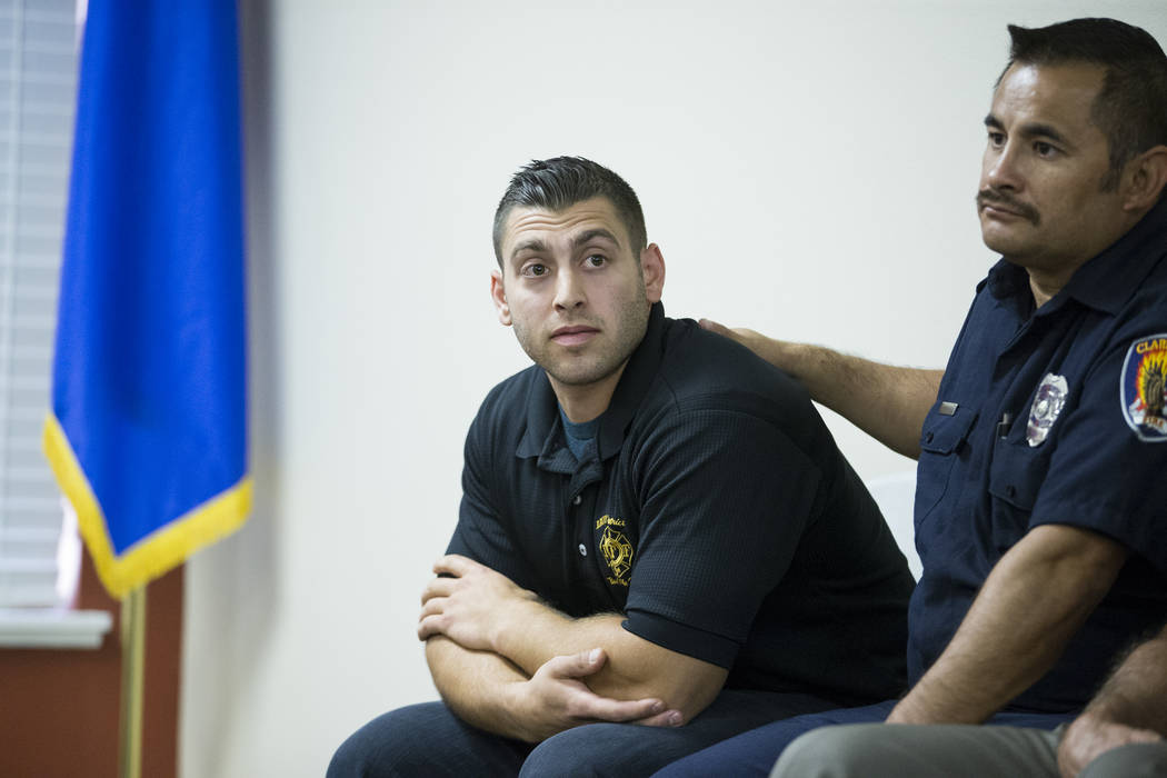 Henderson Firefighter Anthony Robone, left, and Clark County Firefighter Jesse Gomez, during a press conference on the mass shooting on Sunday night, at the Las Vegas Fire Fighters Union Hall in L ...