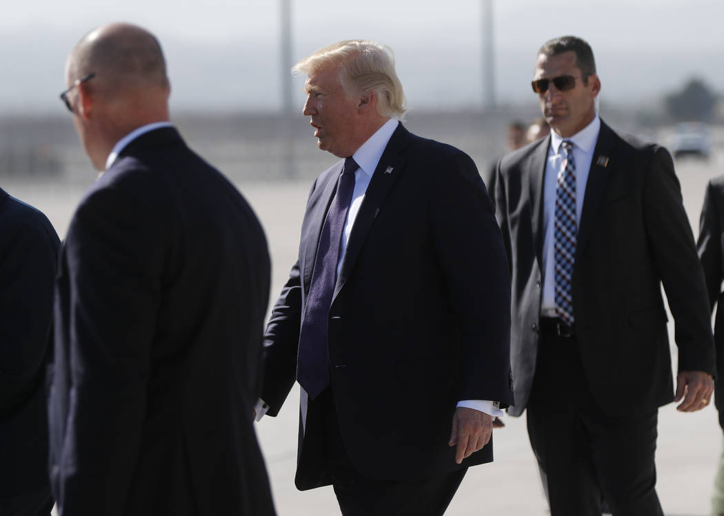 President Donald Trump arrives at McCarran International Airport in Las Vegas on Wednesday, Oct. 4, 2017. A gunman opened fire on attendees of a music festival Sunday night, resulting in the death ...