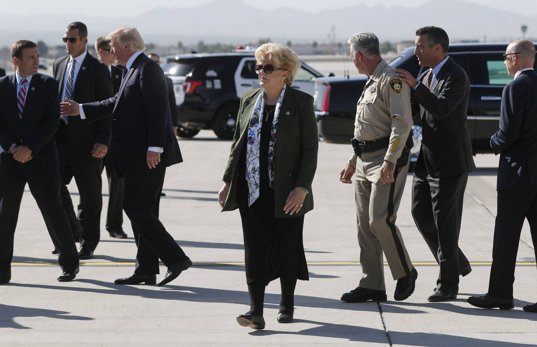 Las Vegas Mayor Carolyn Goodman, center, after the arrival of President Donald Trump at McCarran International Airport on Wednesday, Oct. 4, 2017. A gunman opened fire on attendees of a music fest ...