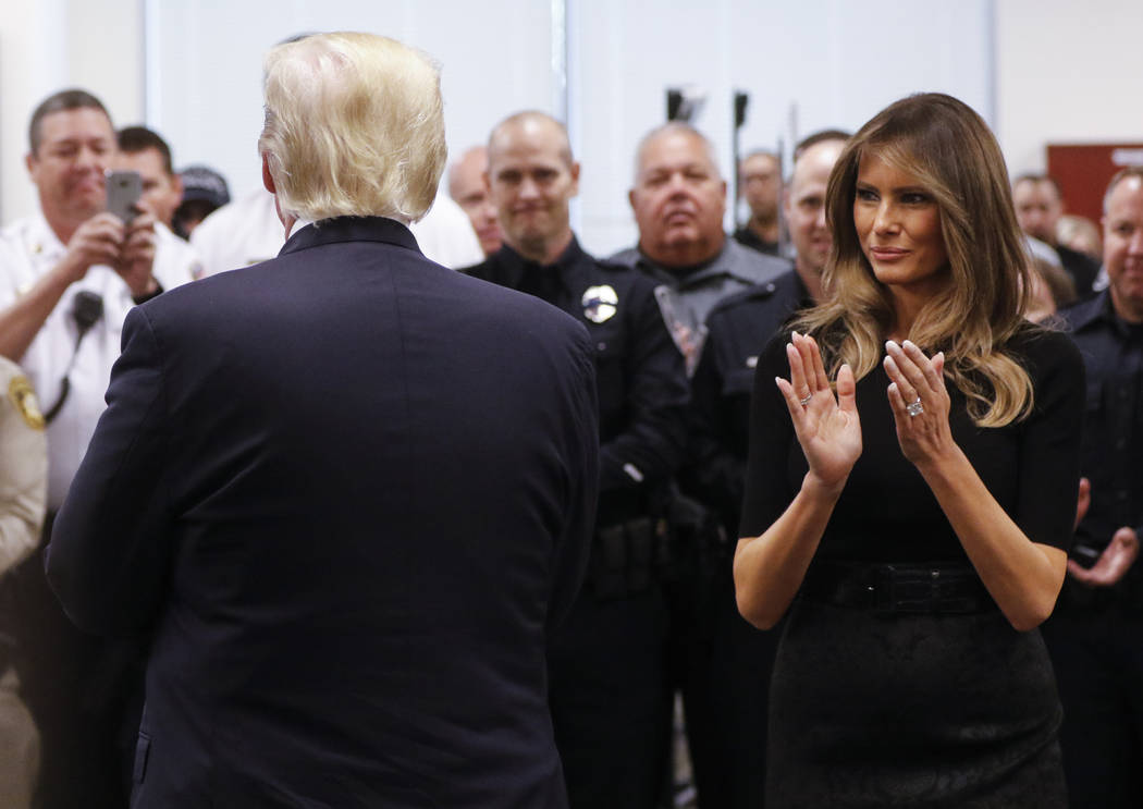 President Donald Trump and first lady Melania Trump visit with law enforcement officers at Metropolitan Police Department headquarters in Las Vegas on Wednesday, Oct. 4, 2017. A gunman opened fire ...