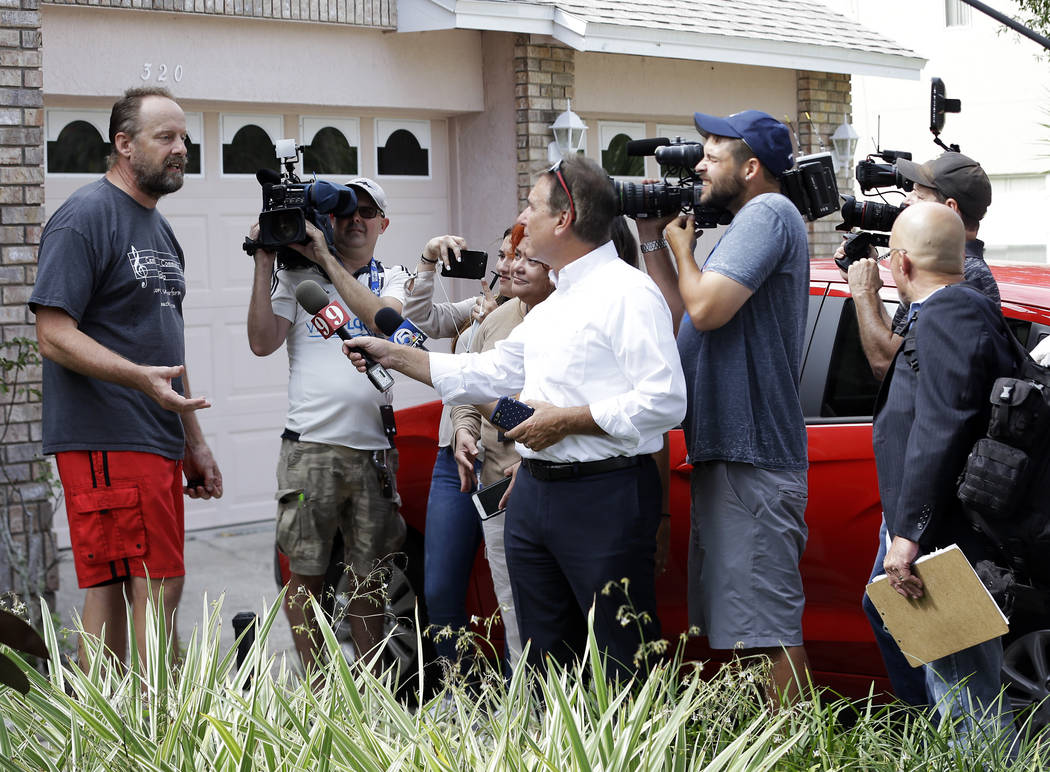Eric Paddock, left, brother of Las Vegas gunman Stephen Paddock, speaks to members of the media outside his home, Monday, Oct. 2, 2017, in Orlando, Fla. Paddock told the Orlando Sentinel: &quo ...