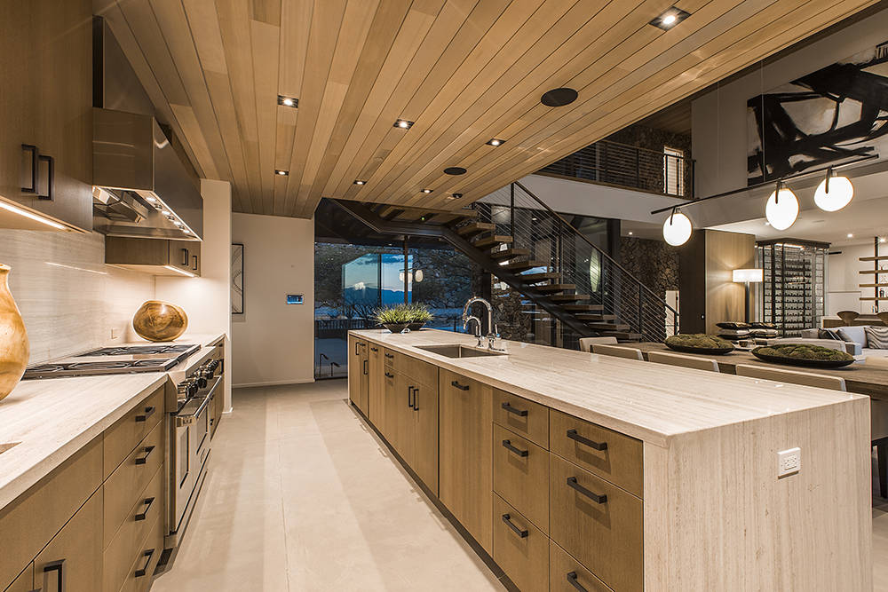 The kitchen features cabinetry made of ammonia-fumed wood. (Fuming is an elaborate wood-finishing process that darkens wood and brings out the natural grain, unlike staining or varnish).  (Ascaya)