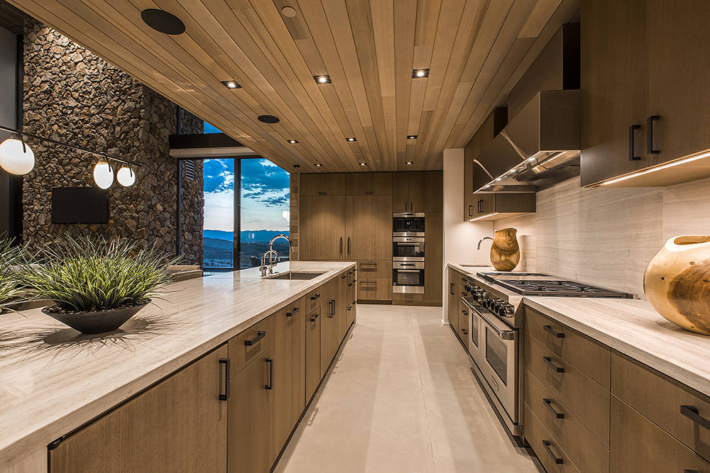 The kitchen features cabinetry made of ammonia-fumed wood. (Fuming is an elaborate wood-finishing process that darkens wood and brings out the natural grain, unlike staining or varnish).   (Ascaya)