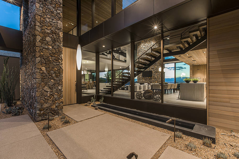The home was designed to have a contemporary look and uses natural materials for a feeling of warmth. (Ascaya)