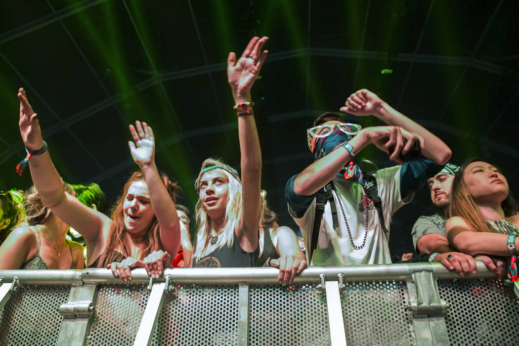 Fans of Pretty Lights cheer during the EDM bands performance on the Fremont Stage during the final day of the Life is Beautiful music and arts festival on Sunday, September 24, 2017, in Las Vegas. ...