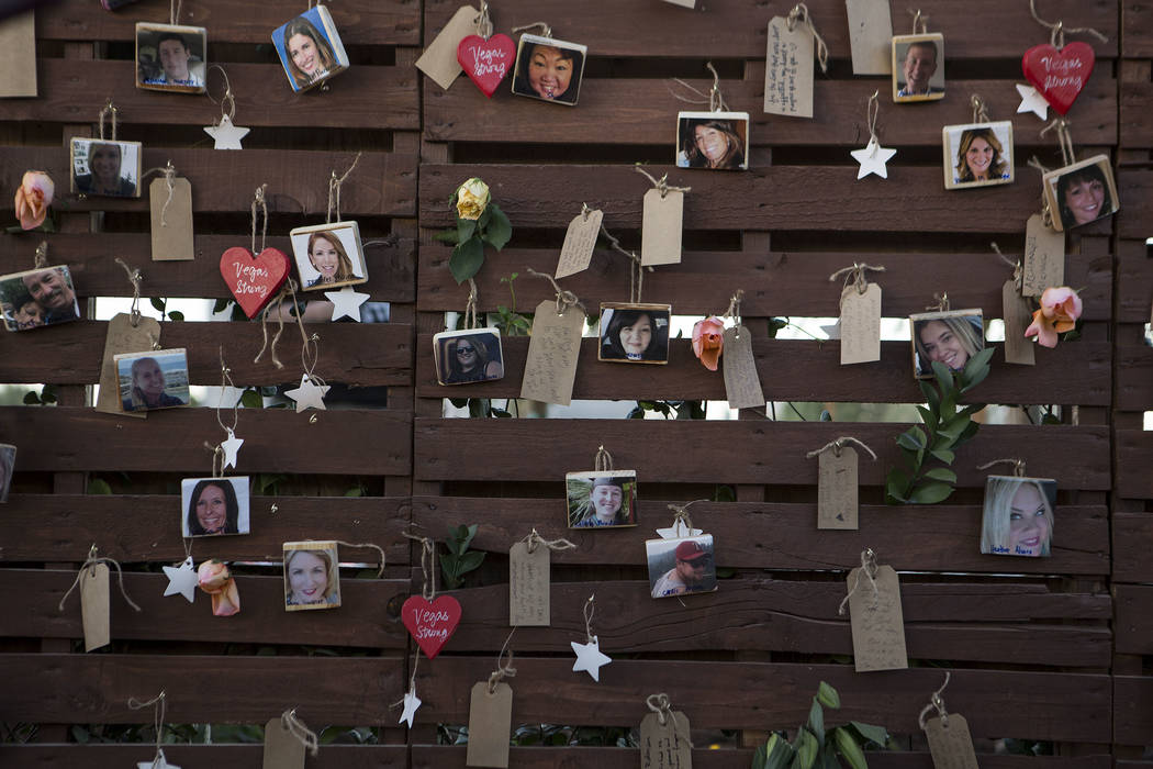 Pictures of victims hang on the &quot;Remembrance Wall&quot; at the Community Healing Garden in Las Vegas, Friday, Oct. 6, 2017. The city of Las Vegas dedicated the new healing garden to v ...
