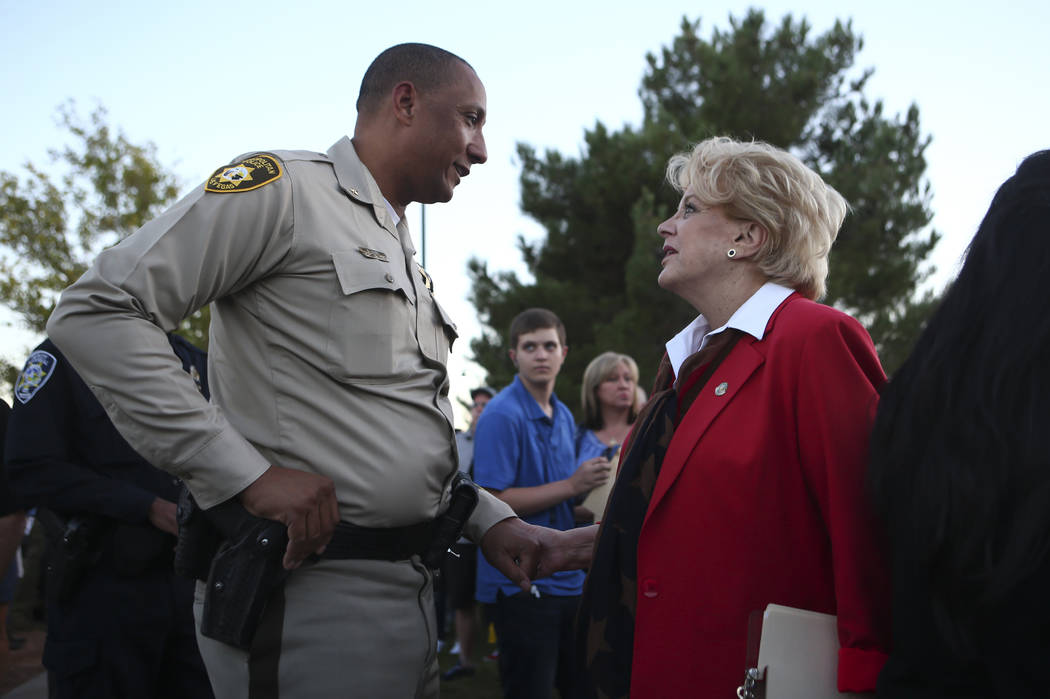 Deputy Chief Charles Hank, left, and Mayor Carolyn Goodman before the start of a candlelight vigil for Las Vegas police officer Charleston Hartfield, who was killed while off-duty in Sunday's mass ...