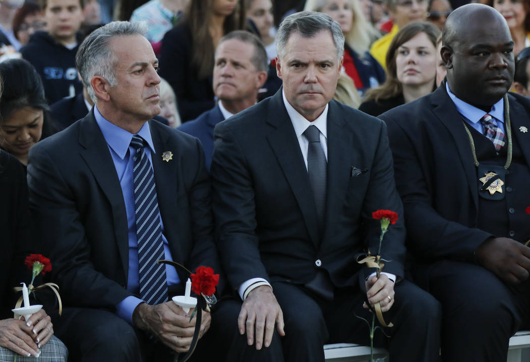 Clark County Sheriff Joe Lombardo, left, and MGM Resorts International Chairman and CEO Jim Murren at the start of a candlelight vigil for Las Vegas police officer Charleston Hartfield, who was ki ...