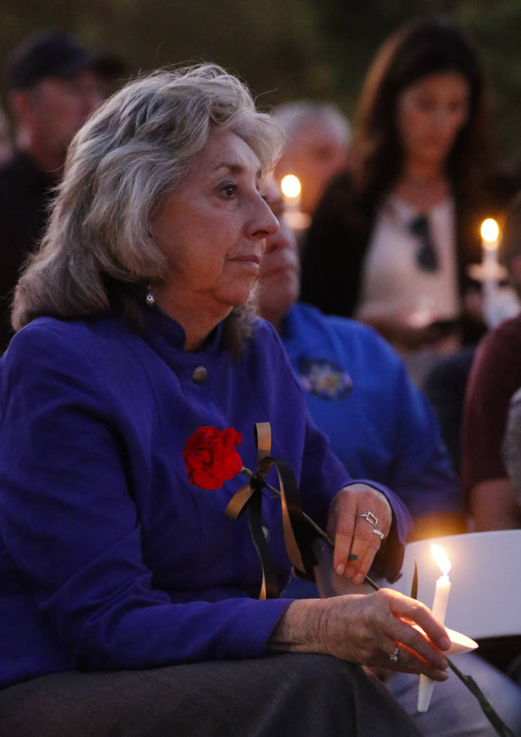 U.S. Rep. Dina Titus, D-Nev., during a candlelight vigil for Las Vegas police officer Charleston Hartfield, who was killed while off-duty in Sunday's mass shooting, at Police Memorial Park in Las  ...
