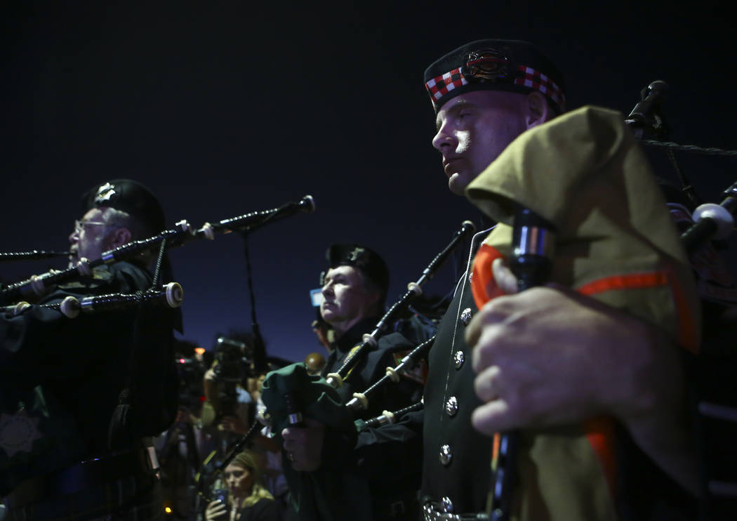 Members of the Honor Guard during a candlelight vigil for Las Vegas police officer Charleston Hartfield, who was killed while off-duty in Sunday's mass shooting, at Police Memorial Park in Las Veg ...