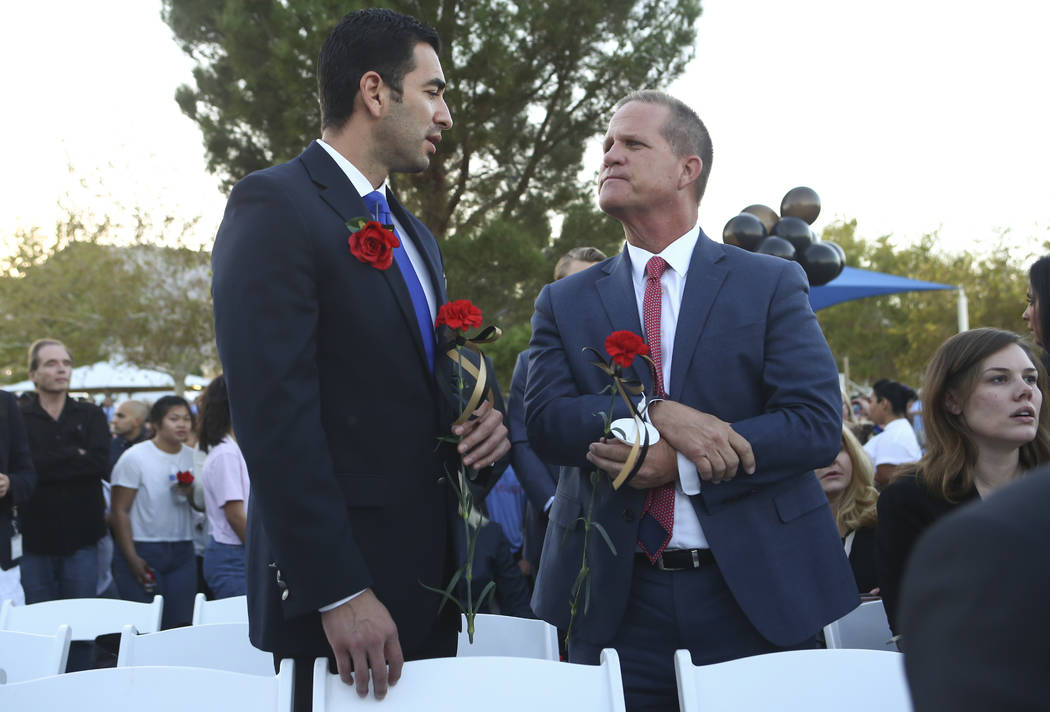 U.S. Rep. Ruben Kihuen, D-Nev., and Nevada Lt. Gov. Mark Hutchison during a candlelight vigil for Las Vegas police officer Charleston Hartfield, who was killed while off-duty in Sunday's mass shoo ...