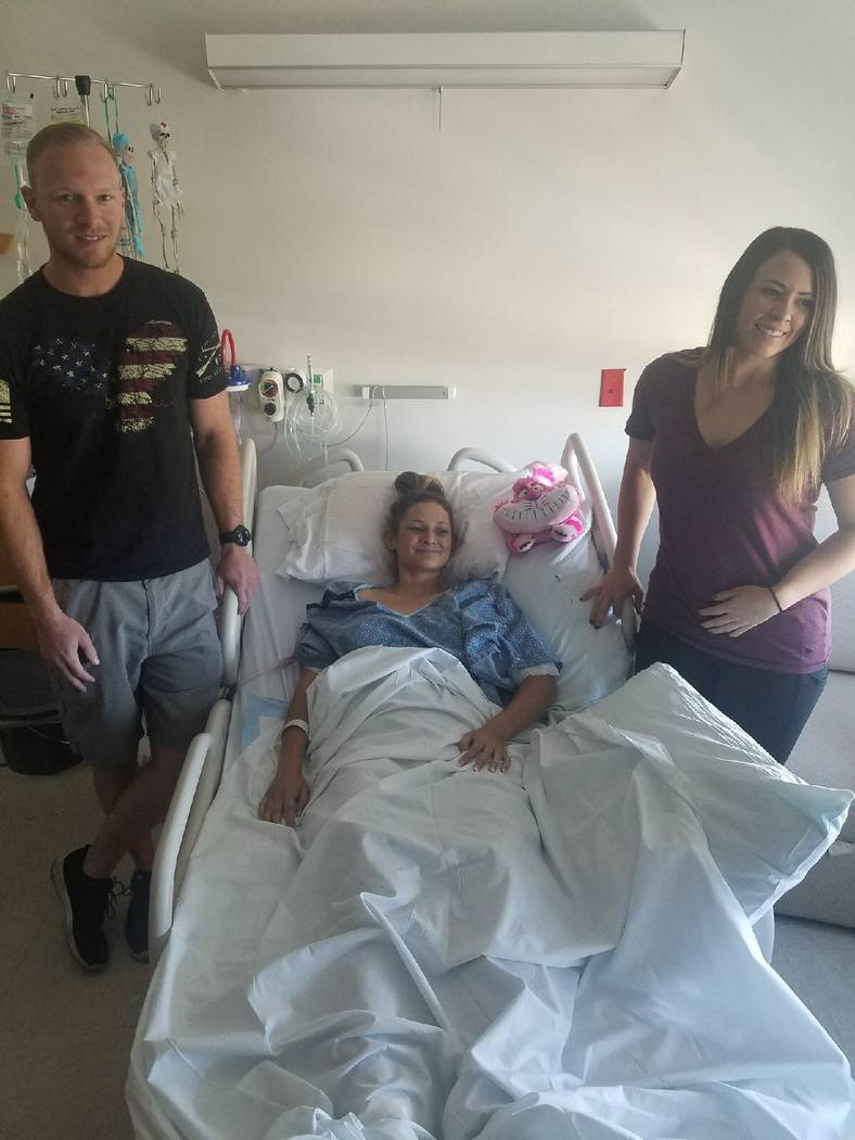 Mikkena Parry, 18, (center), is reunited with Ryan Guay (left) and Lynzee Freund, who helped get her to Desert Springs Hospital on Sunday after the mass shooting at the Route 91 Harvest country mu ...