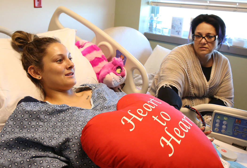 Mikenna Parry, 19, of Las Vegas speaks during an interview from her hospital bed as her mother Stephanie looks on Friday, Oct. 6, 2017, in Las Vegas. Perry is recovering from last Sunday's gunshot ...
