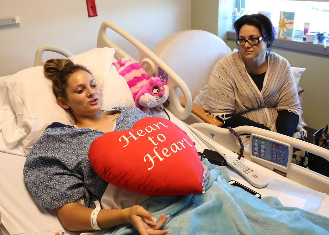 Mikenna Parry, 19, of Las Vegas speaks during an interview from her hospital bed as her mother Stephanie looks on Friday, Oct. 6, 2017, in Las Vegas. Perry is recovering from last Sunday's gunshot ...