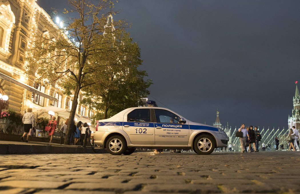 A police car is parked in front of the GUM, State Shop, at Red square in Moscow, Russia on Wednesday, Sept. 13, 2017. (Pavel Golovkin/AP)