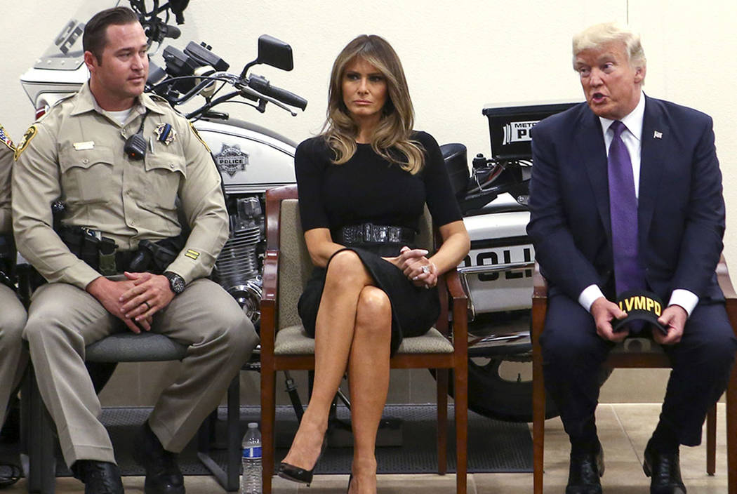 President Donald Trump and first lady Melania Trump meet with Metro officer Casey Clarkson, left, and other first responders at Metropolitan Police Department headquarters in Las Vegas on Wednesda ...