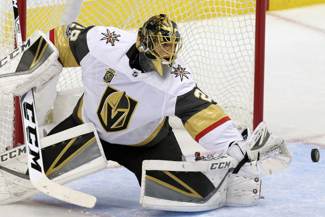 Vegas Golden Knights goalie Marc-Andre Fleury blocks a shot during the first period of an NHL hockey game against the Dallas Stars in Dallas, Friday, Oct. 6, 2017. (AP Photo/LM Otero)