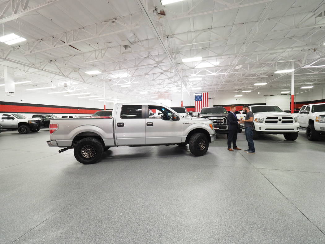 B5 Motors owner Shane Beus in Gilbert, Arizona, presents Taylor Winston, 29, with a 2013 F150 truck. The
Marine veteran was attending the Route 91 Harvest Festival concert when shooting broke out. ...