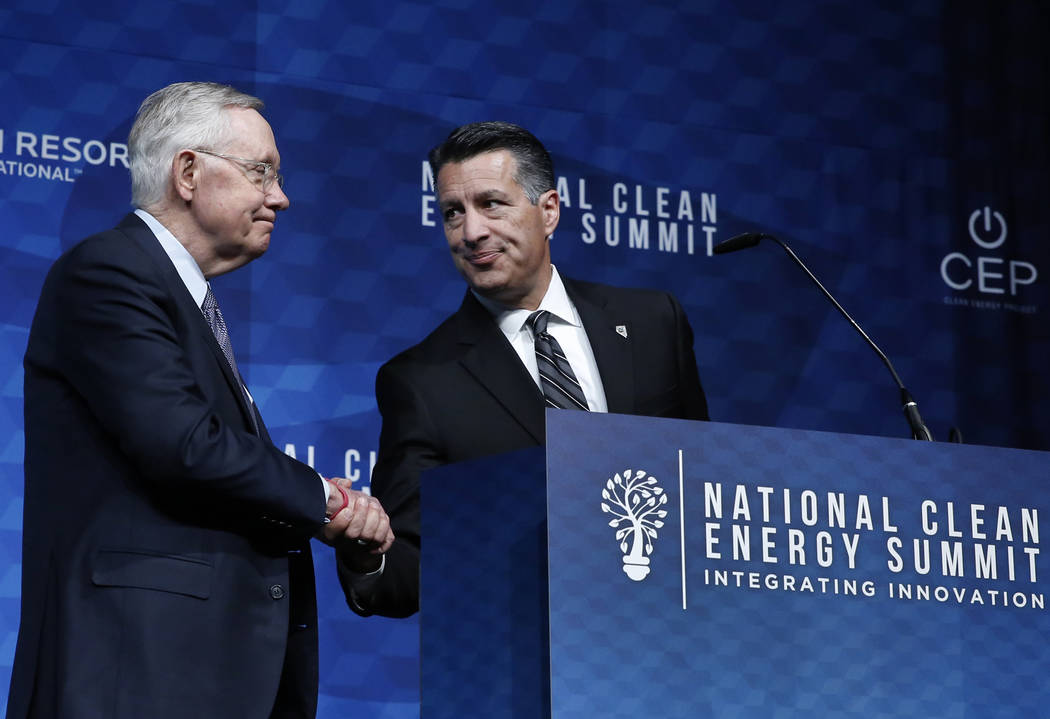 Gov. Brian Sandoval, right, introduces former U.S. Senate Harry Reid (D-Nev.) during the National Clean Energy Summit Friday, Oct. 13, 2017, in Las Vegas. Bizuayehu Tesfaye Las Vegas Review-Journa ...