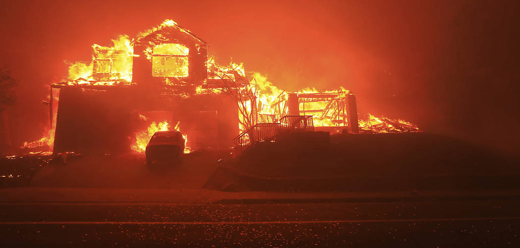 A home burns in Fountaingrove, Monday Oct. 9, 2017 in Santa Rosa, Calif. More than a dozen wildfires whipped by powerful winds been burning though California wine country. The flames have destroye ...