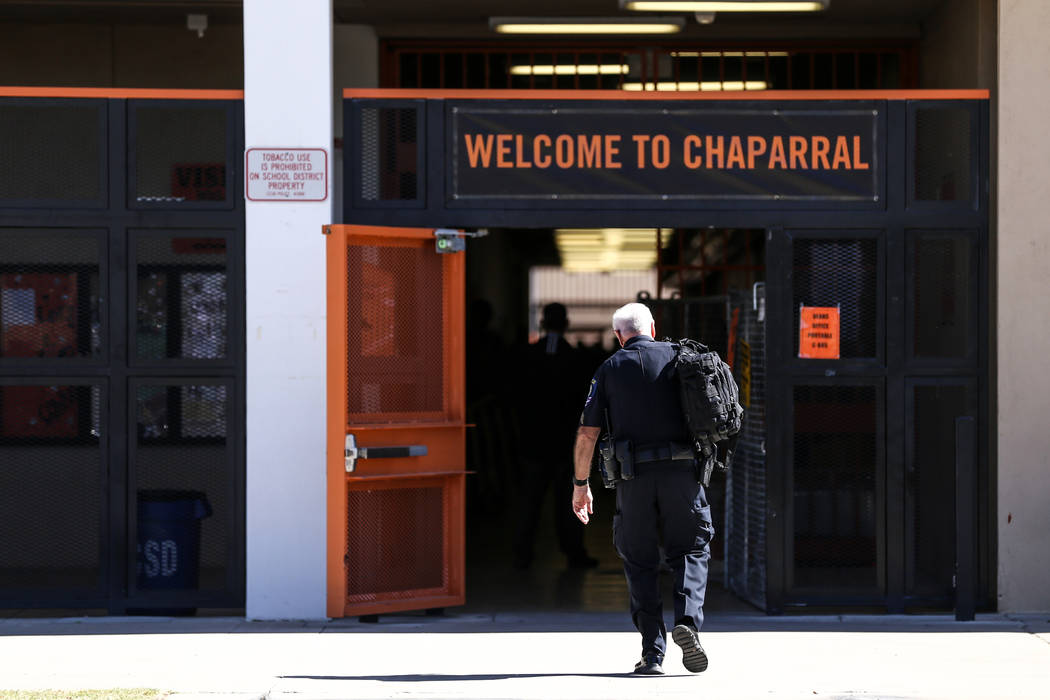 A Clark County School District police officer heads towards Chaparral High School after a student was stabbed in the chest in Las Vegas, Tuesday, Oct. 10, 2017. Joel Angel Juarez Las Vegas Review- ...