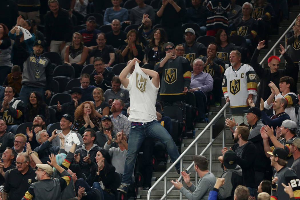 A man take his shirt off during the second period against the Arizona Coyotes at T-Mobile Arena in Las Vegas, Tuesday, Oct. 10, 2017. Bridget Bennett Las Vegas Review-Journal @BridgetKBennett