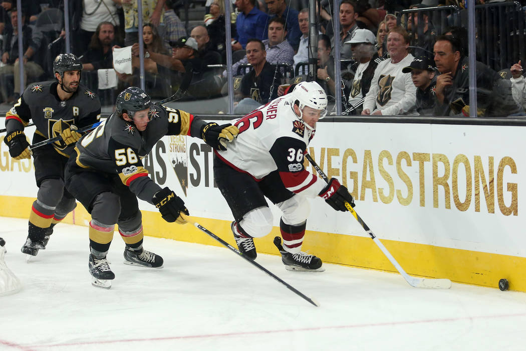 Vegas Golden Knights left wing Erik Haula (56) and Arizona Coyotes right wing Christian Fischer (36) chase after th puck during the third period against the Arizona Coyotes at T-Mobile Arena in La ...