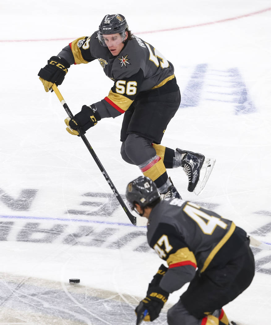 Vegas Golden Knights left wing Erik Haula (56) passes the puck to Knights defenseman Luca Sbisa (47) during the second period of an NHL hockey game between the Vegas Golden Knights and the Arizona ...